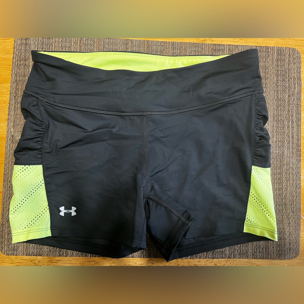 Under Armor heat gear shorts Size: Medium color black and neon yellow. Like new.